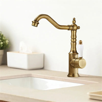 Antique brass bronze basin faucet with white ceramic handle and vintage design for cold water deck mounting