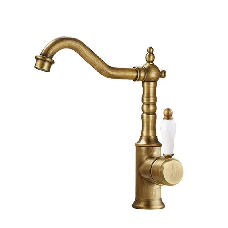 Antique brass basin faucet with curved spout and white ceramic handle for cold water deck mounted use