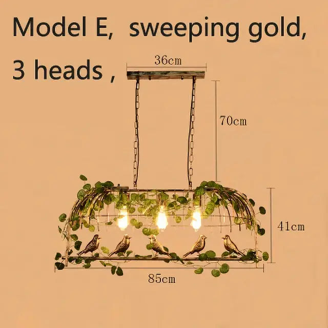 Bronze birdcage pendant lights with garland feature a sweeping gold three-head chandelier with rustic metal frame and vines