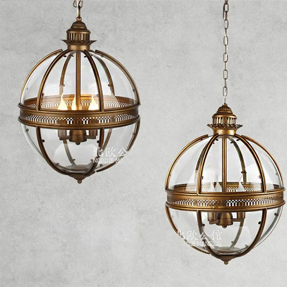 Bronze black glass globe chandelier foyer light featuring antique brass globe pendant lights with intricate metalwork and clear glass panels