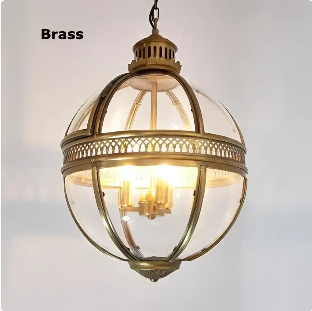 Antique brass globe pendant light with clear glass panels and intricate lattice detailing in decorbites bronze black finish