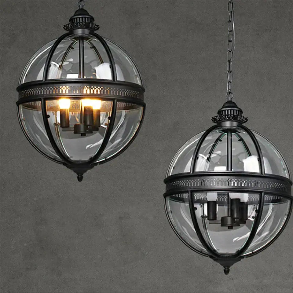Bronze black glass globe chandelier foyer light featuring black wrought iron globe pendant lights with clear panels and ornate details