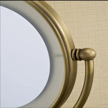 Bronze brass wall mounted round vanity mirror with led magnifying light and antique brass-finished frame by decorbites