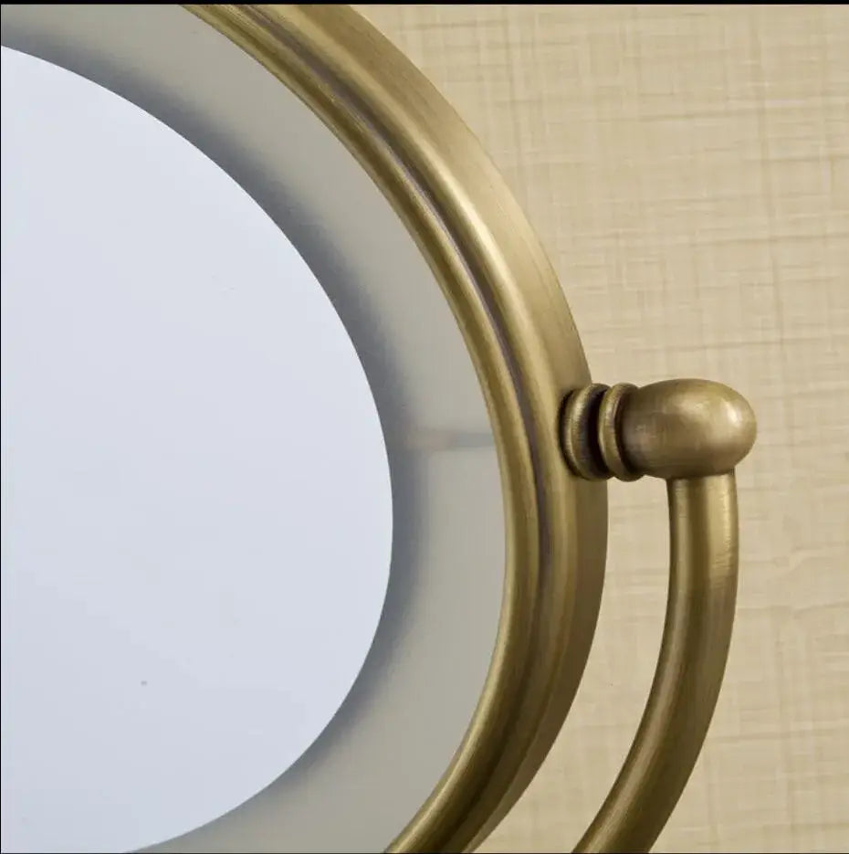 Bronze brass wall mounted round vanity mirror with led magnifying light and antique brass-finished frame by decorbites