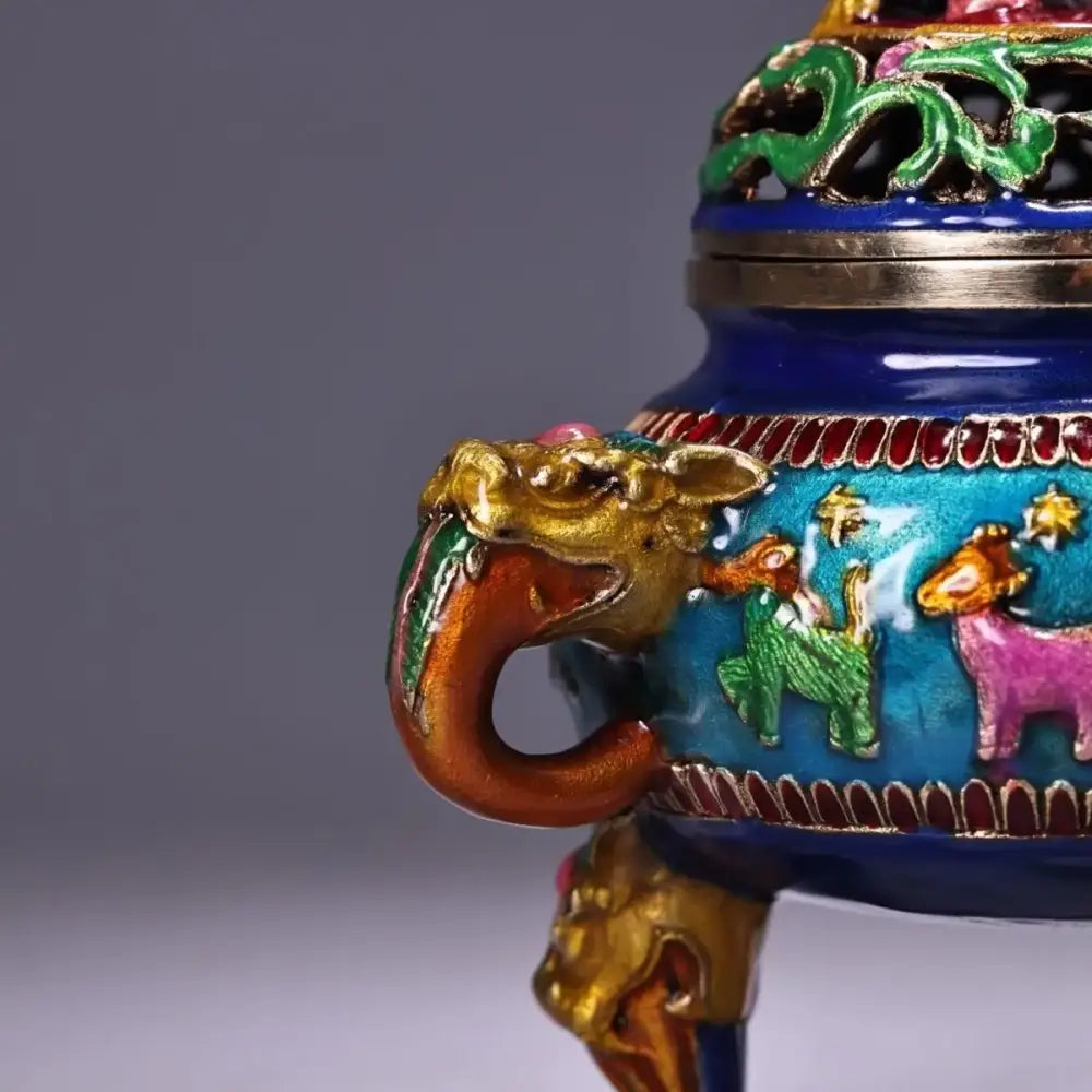 Vibrant blue enamel bronze cloisonne lion incense burner with gold dragon handle and colorful animal motifs decorbites decor