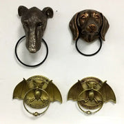 Bronze dog head door and bat door knocker pendant with black rings for courtyard wall installation