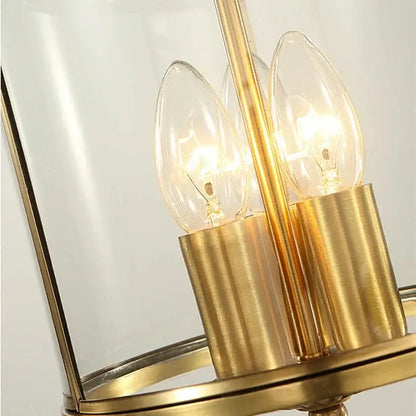 Bronze glass chandelier pendant light with gold-toned metal frame and three illuminated filament bulbs for dining room decorbites bronze glass