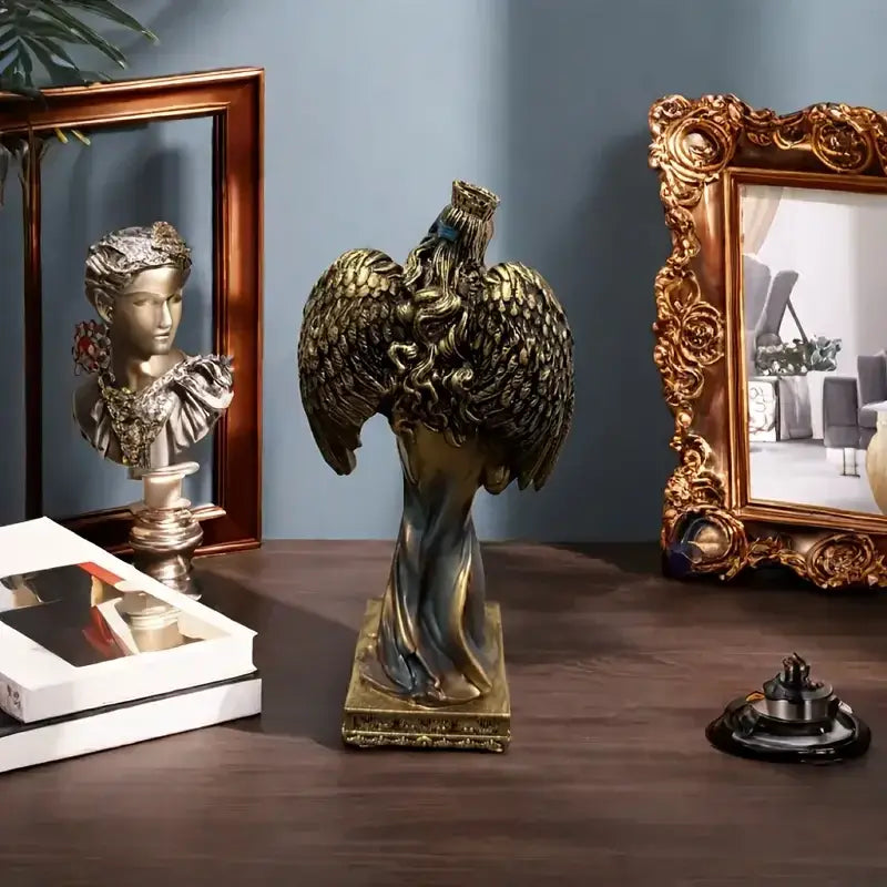 Golden angel goddess fortune figurine with detailed feathered wings and draped fabric on a square base for office decor