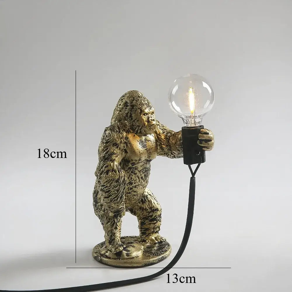 Bronze king kong gorilla table lamp with textured muscular design holding exposed filament bulb for bedroom night light