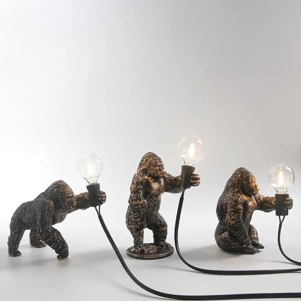Bronze king kong gorilla table lamp with textured fur finish holding exposed light bulbs for bedroom night light