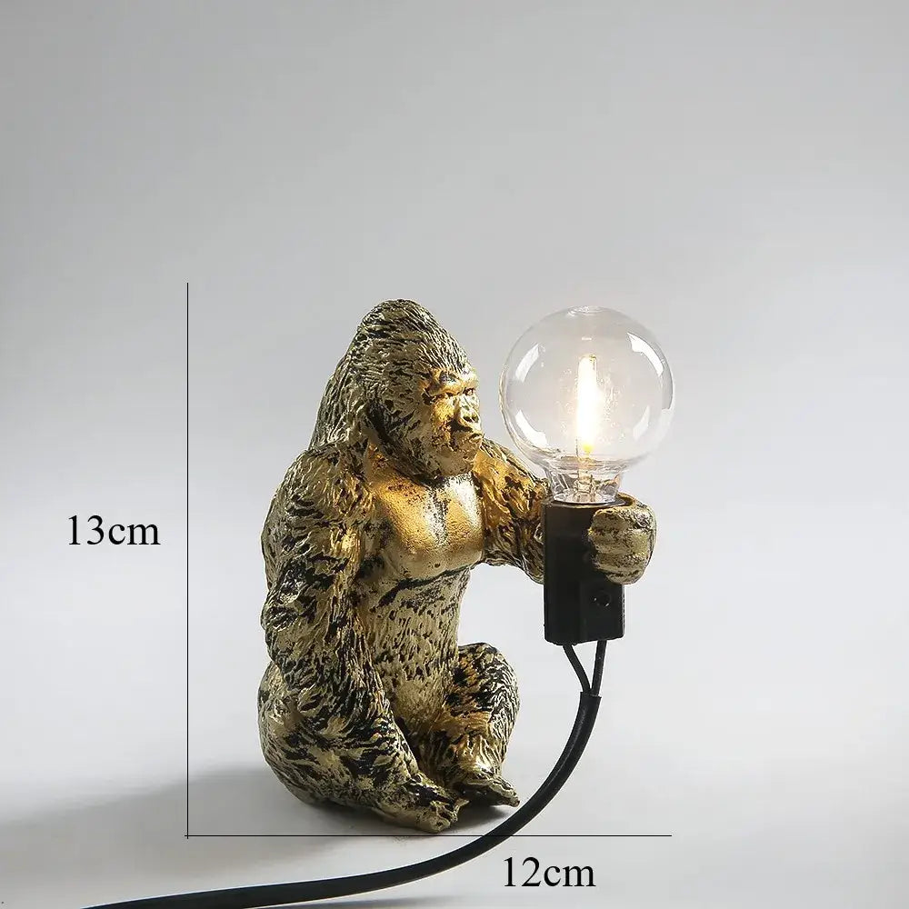 Bronze king kong gorilla table lamp in gold holding a clear bulb ideal as a bedroom night light and gorilla table lamp