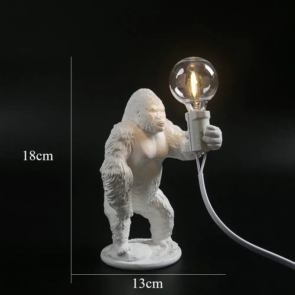 White ceramic king kong gorilla table lamp holding a clear glass bulb for bedroom night light decorbites king kong design