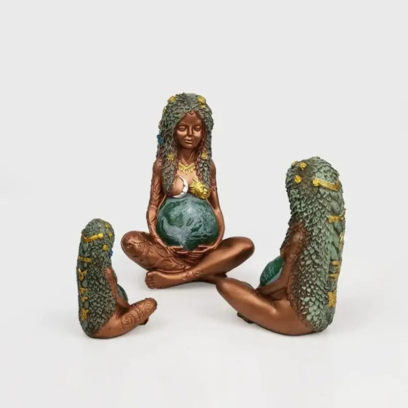 Bronze mother earth goddess figurine with green and gold leafy hair holding a teal globe for living room decorbites gaia mother