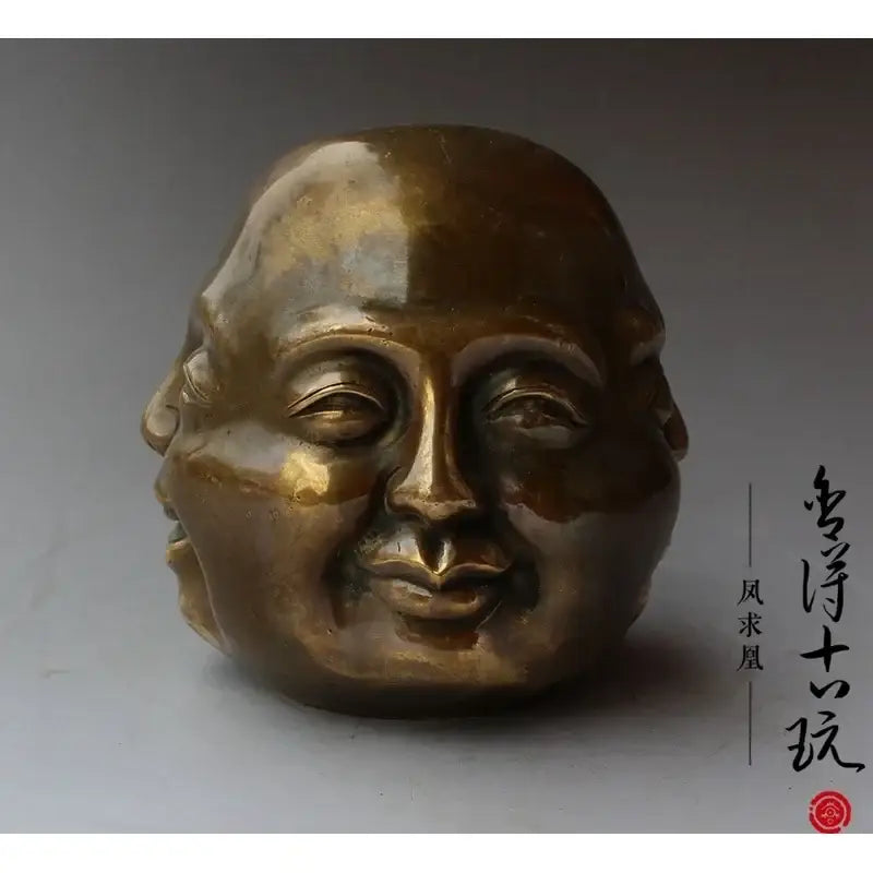 Bronze polished buddha head statue with smooth surface and serene expression for living room decor