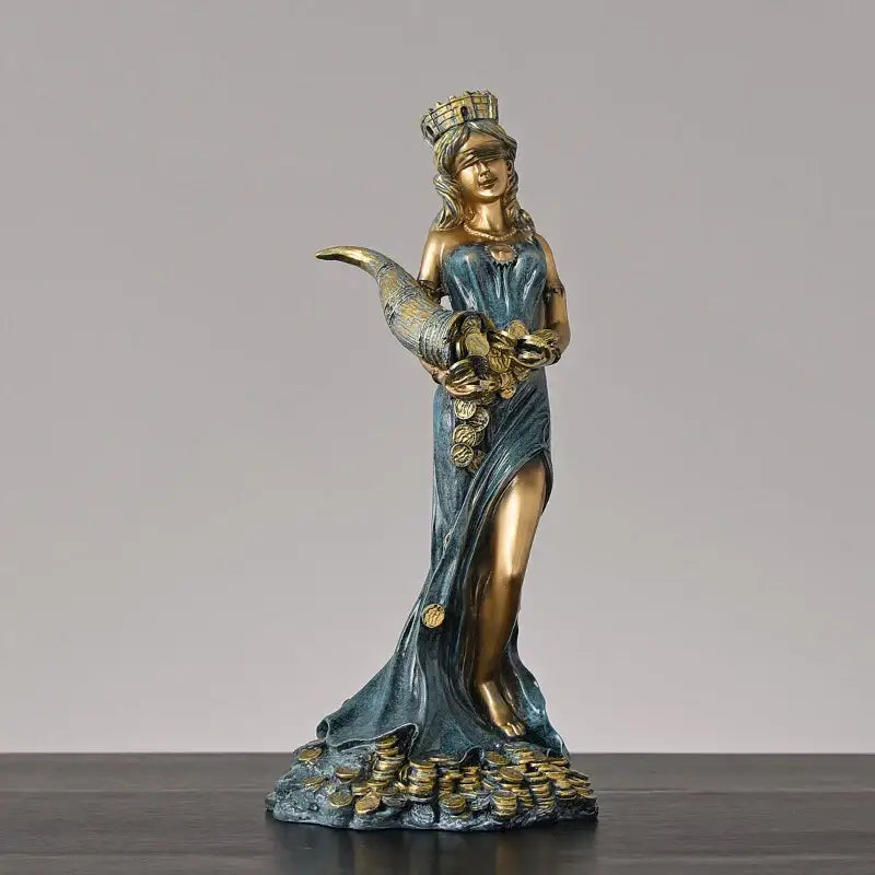 Bronze and teal greek wealth goddess fortuna figurine in flowing robes holding coins on a base with gold coins for decor
