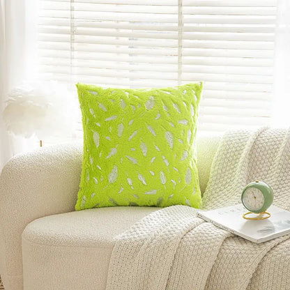 Lime green velvet throw pillow with white feather embroidery in bronzed feather style for living room decor