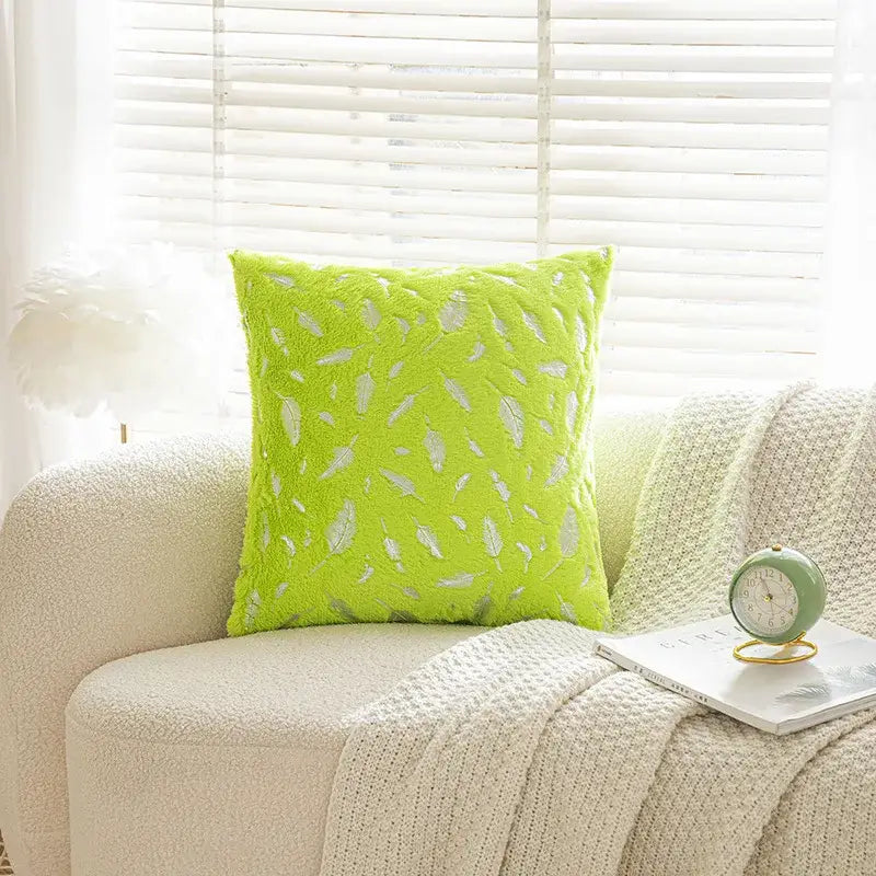 Lime green velvet throw pillow with white feather embroidery in bronzed feather style for living room decor