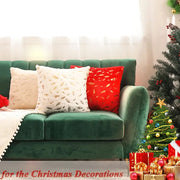 Emerald green velvet sofa with bronzed feather style cream and red patterned throw pillows for living room decor