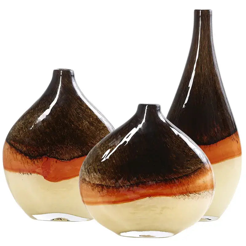 Set of three glossy decorbites gradient glass vases in brown amber and cream hues for home decor living room use