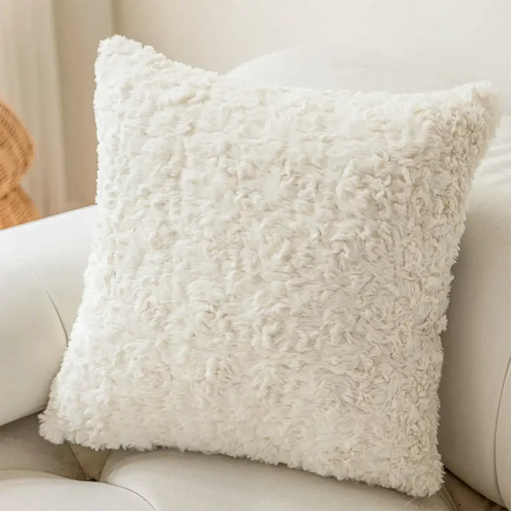 White fluffy faux fur plush cushion cover with soft texture and brown and white geometric embroidery for living room