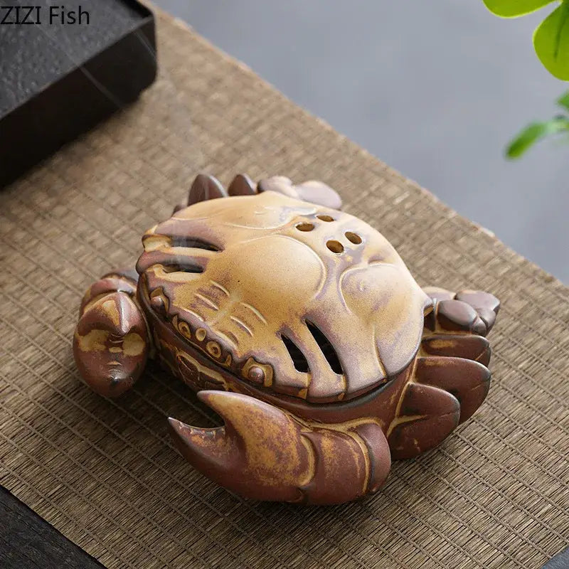 Brown and beige ceramic incense burner shaped like a crab with glazed finish and detailed carapace patterns