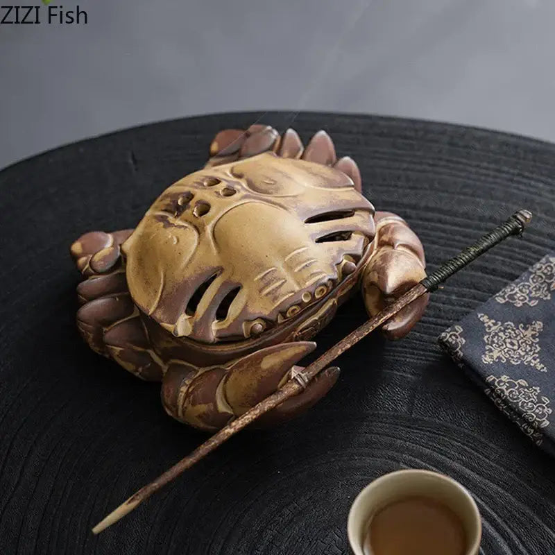 Brown and beige crab ceramic incense burner with glazed brown and gold finish and detailed carapace ridges for aromatherapy