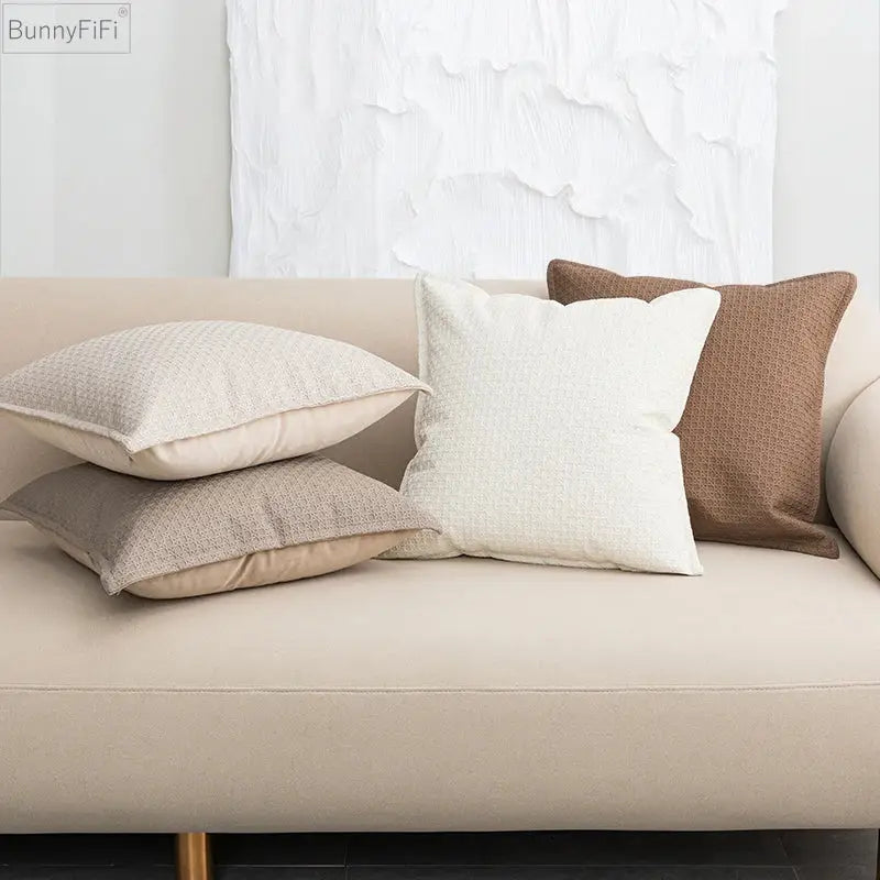 Beige and brown faux leather cushion cover 45x45cm with textured woven pattern arranged on light sofa decorbites brown beige