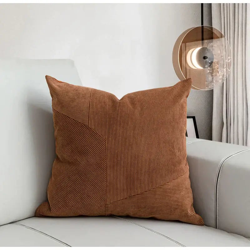 A square rust-colored brown corduroy patchwork cushion cover for living room decor by decorbites