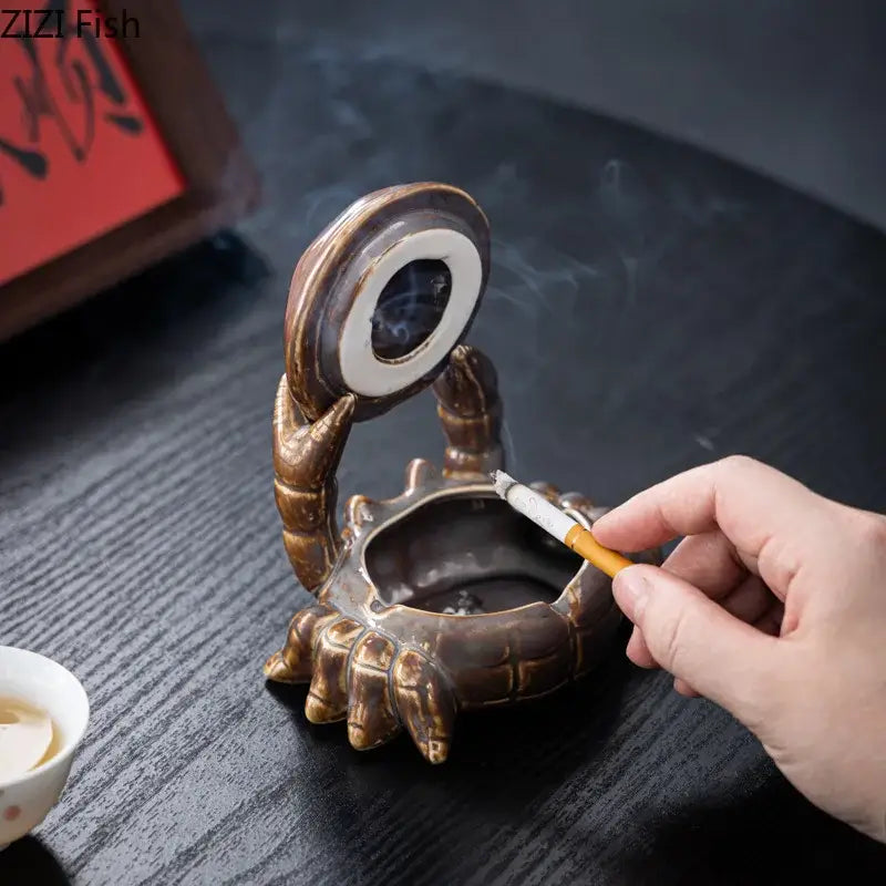 Brown crab ceramic ashtray with bronze scorpion design and raised eye lid doubles as phone holder and office decorbites decor