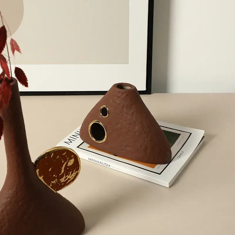 Brown geometric triangle ceramic vase with textured surface and gold accent decorbites openings for living room decor