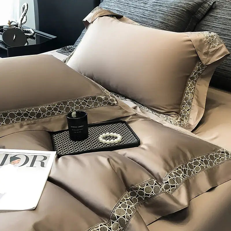 Beige satin pillowcases with elegant dark brown lace trim part of decorbites brown lace embroidery bedding set