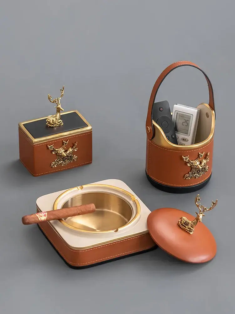 Brown leather desktop storage basket with gold deer embellishments and polished brass interior for office use