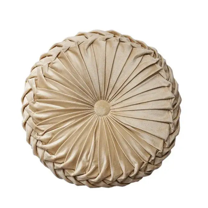 Beige velvet round seat cushion with braided pleated design and central button for living room use