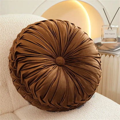 Brown pleated dutch velvet round seat cushion with gathered design and central button for living room use