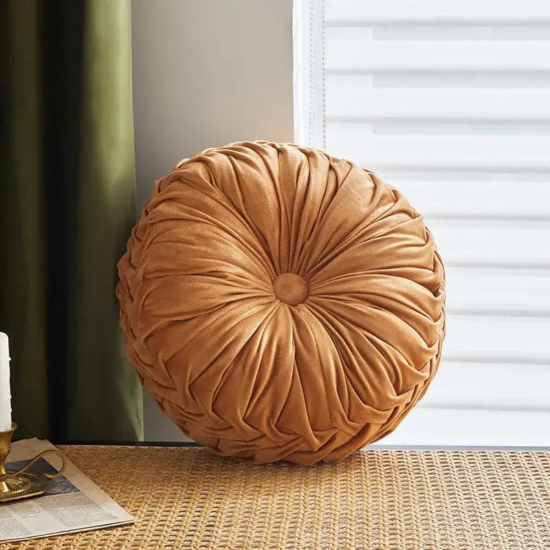 Brown pleated dutch velvet round seat cushion in warm caramel with radial pleats and central button for living room