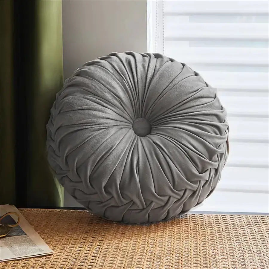 Brown pleated dutch velvet round seat cushion with a plush gray velvet radial pleated design and central button