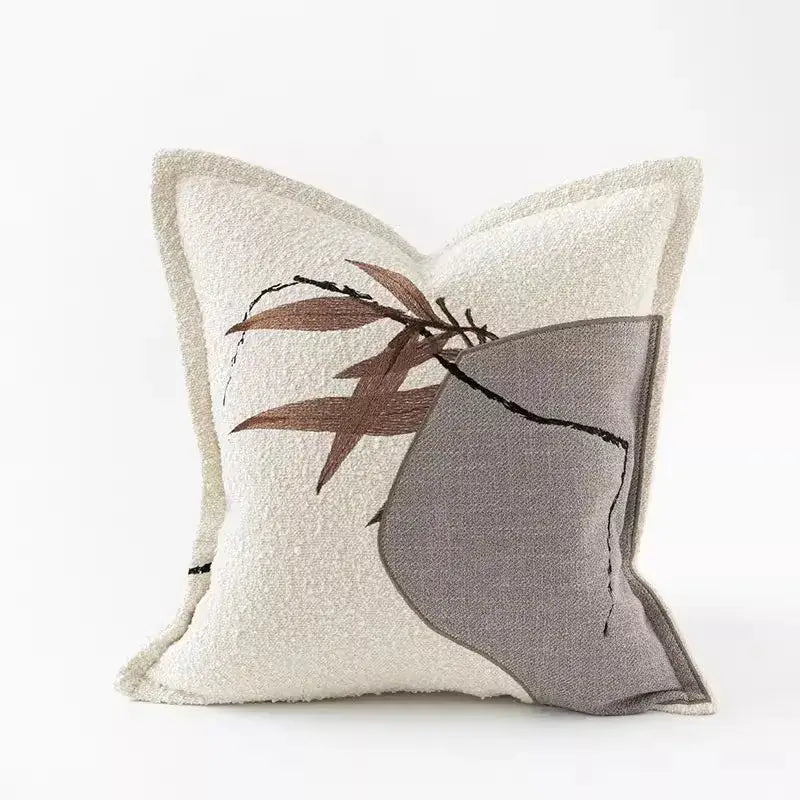Cream-colored textured pillow cover with embroidered brown bamboo leaves and gray geometric panel auspicious clouds jacquard