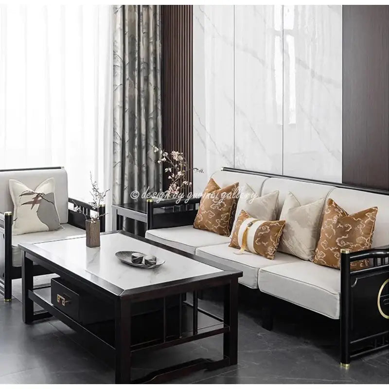 Black-framed sofa with white upholstery and brown and white auspicious clouds jacquard pillow cover throw pillows