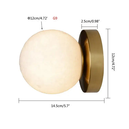 Brushed brass decorbites circular planet wall lamp with an off-white matte globe and brass metallic base for bedroom use