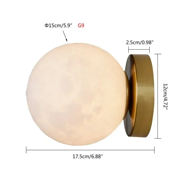 Brushed brass decorbites circular planet wall lamp featuring an off-white textured moon-shaped globe with brass base