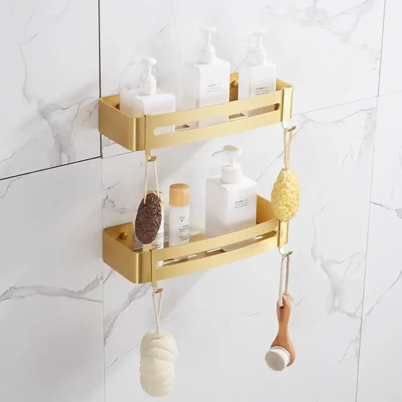 Brushed gold aluminum 2 tier corner shower shelf with hooks featuring minimalist cutouts for modern bathroom decor