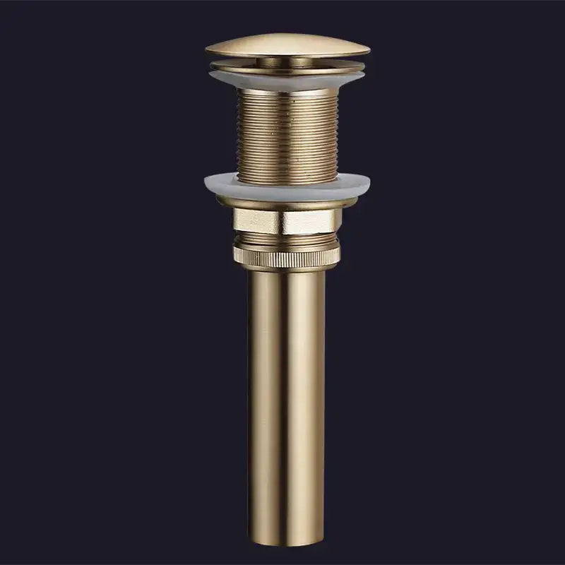 Brushed gold and white ceramic bathroom sink drain assembly kit with gold-toned brass cylindrical body and threaded sections