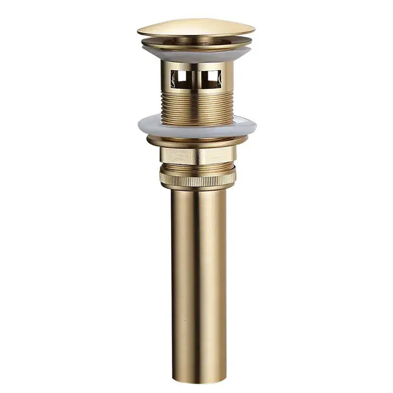 Brushed gold and white ceramic bathroom sink drain assembly kit with gold-toned cylindrical drain assembly kit component