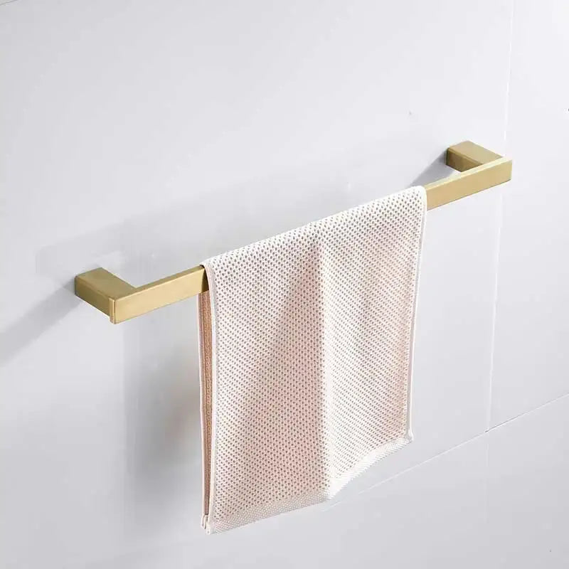 Brushed gold stainless steel rectangular towel rack with white mesh-patterned towel from decorbites brushed gold set
