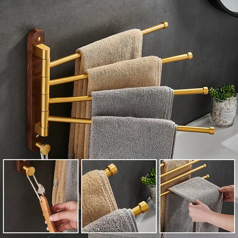 Brushed gold swivel towel hanger with dark wood base holding folded beige and gray towels in bathroom rack design