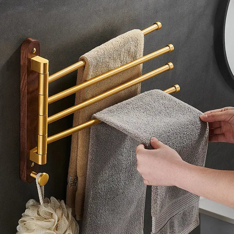 Brushed gold and wood swivel towel hanger featuring a multi-tiered towel rack with a dark wood mounting plate