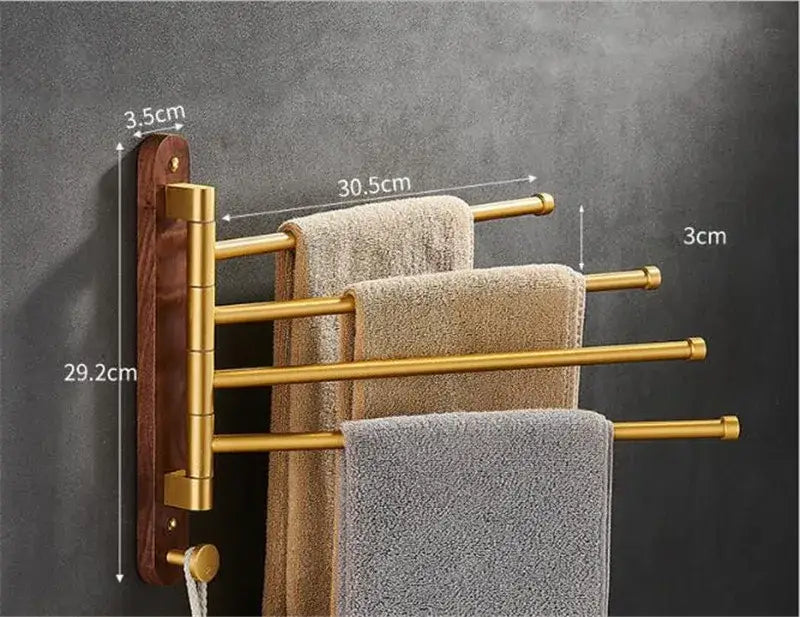Brushed gold four-tiered swivel towel hanger with dark wood backplate for bathroom organization