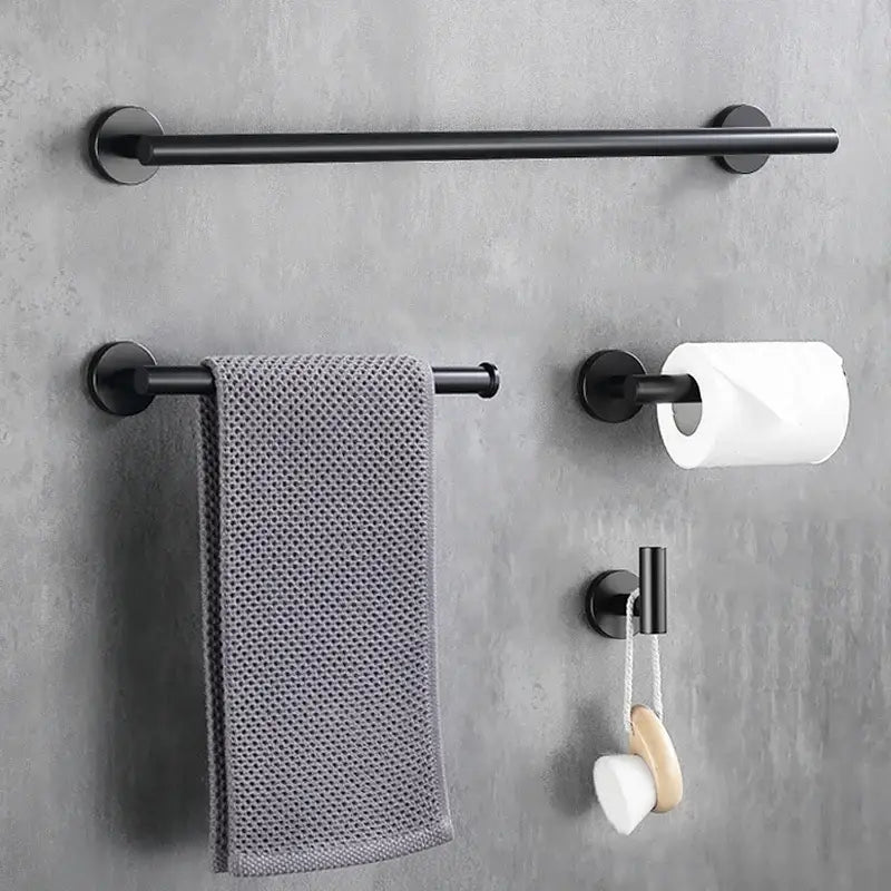 Black matte metal towel rack with circular mounts and textured gray towel for decorbites brushed gold bathroom set