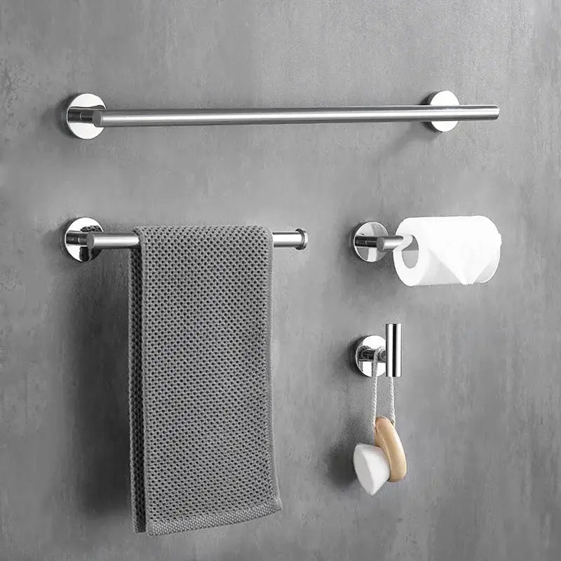 Chrome-finished towel rack with textured gray woven towel complementing decorbites brushed gold bathroom accessories set