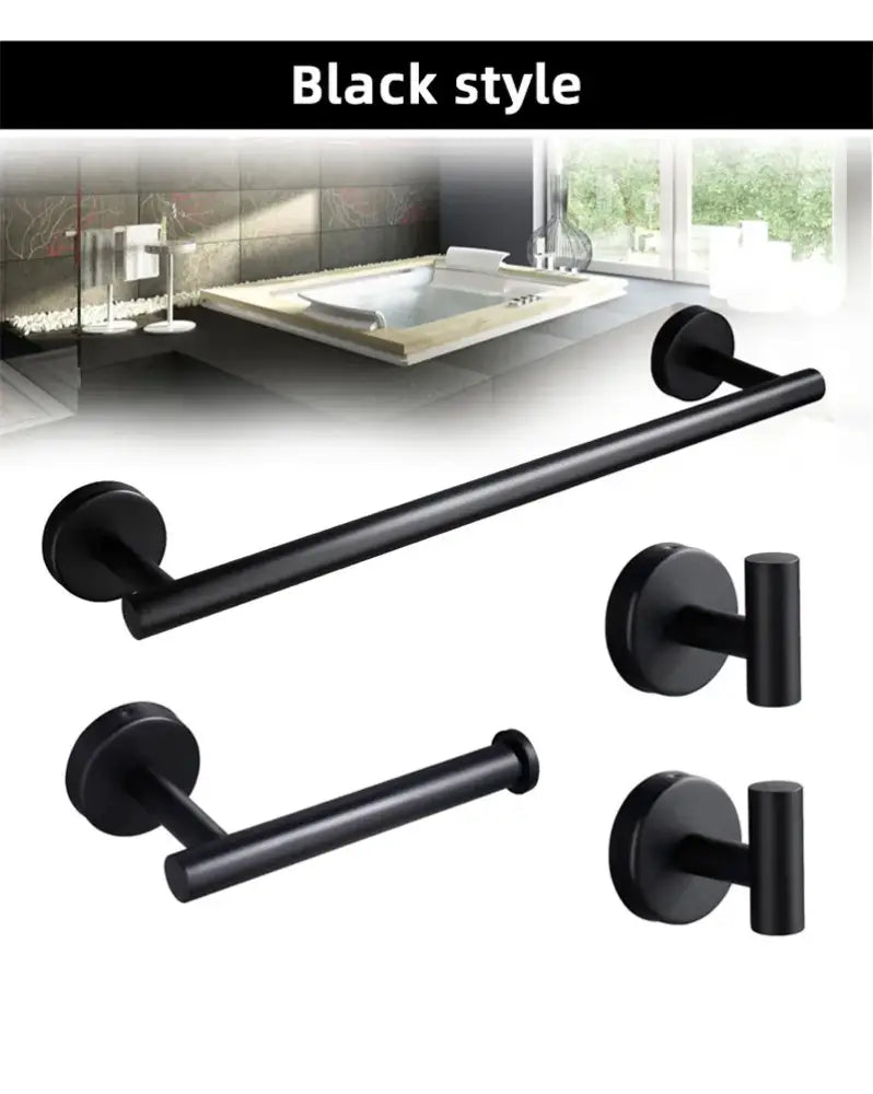 Black matte metal towel rack and toilet paper holder contrast a brushed gold bathroom hardware set for modern use